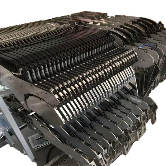 Samsung Hanwha SMT feeders stacked in bulk — SM series feeder compatibility guide