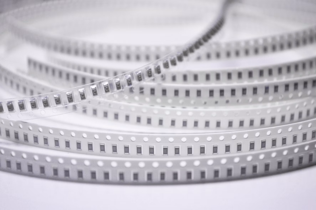 SMT chip components on carrier tape ready for pick-and-place feeder loading