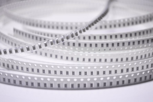 SMT chip components on carrier tape ready for pick-and-place feeder loading